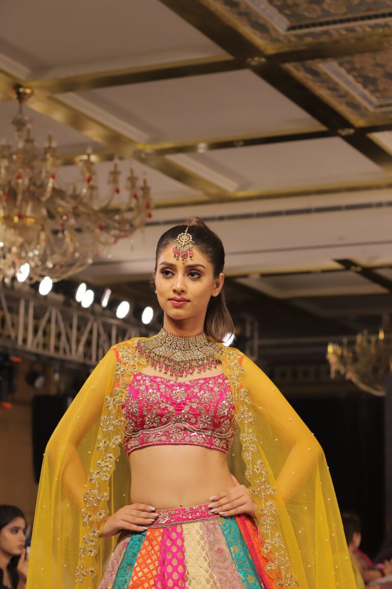 a model walks the ramp at a fashion show